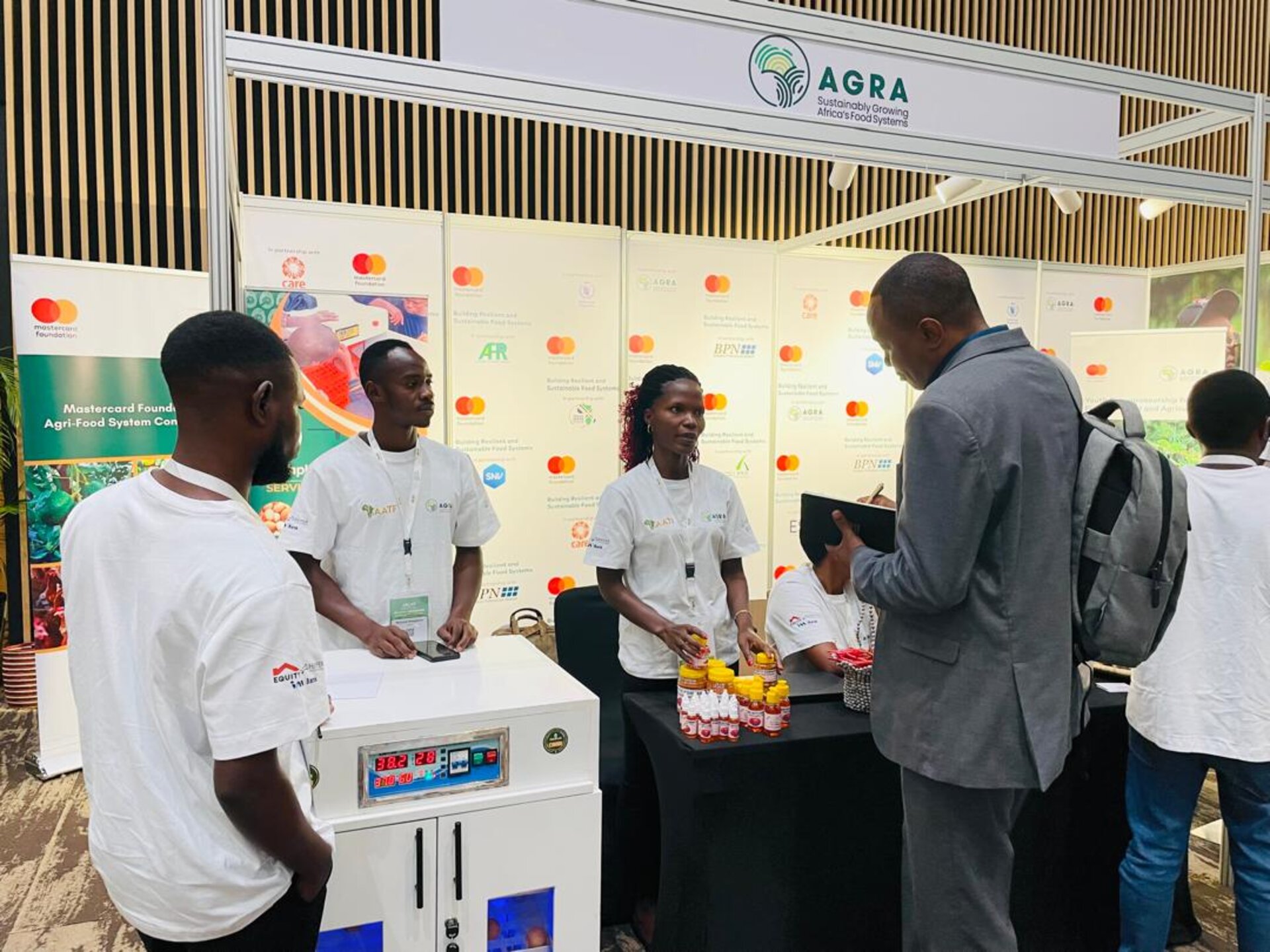 The TechPlus Trust team engaging visitors at the AGRA exhibition booth