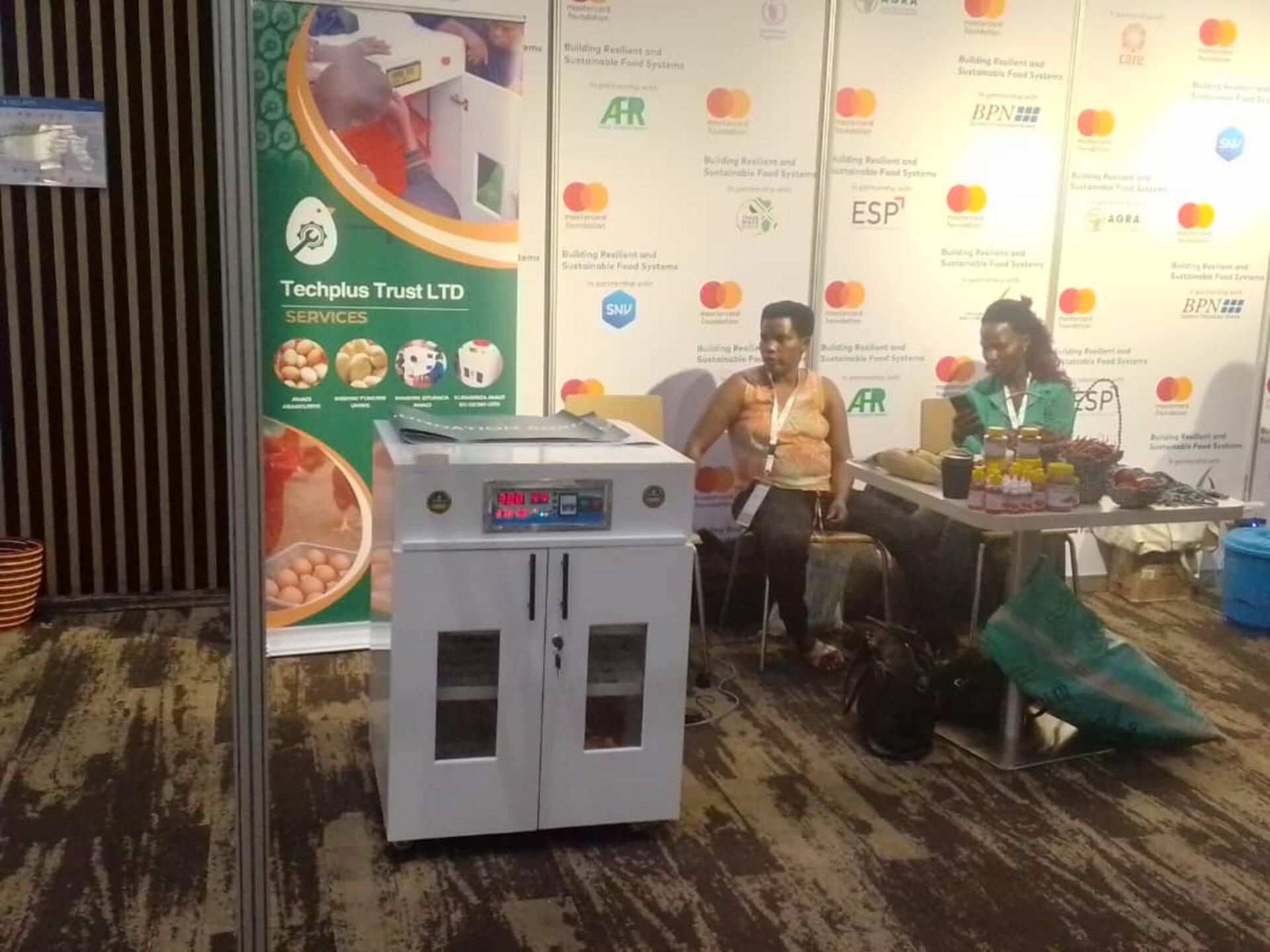The TechPlus Trust team with an incubator at a partner exhibition